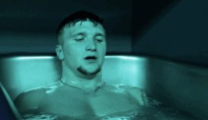 Man immersed in a cold plunge tub focusing on breathwork at MindFuel Method in Pittsburgh