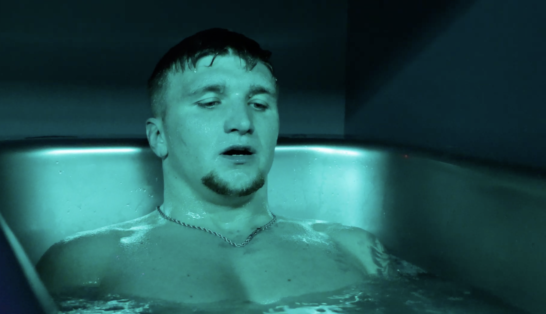 Man immersed in a cold plunge tub focusing on breathwork at MindFuel Method in Pittsburgh