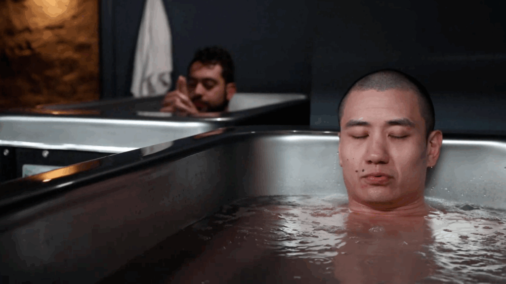 Two men practicing cold plunge therapy at MindFuel in Pittsburgh, focusing on breathwork, recovery, and mental resilience.