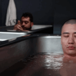 Two men practicing cold plunge therapy at MindFuel in Pittsburgh, focusing on breathwork, recovery, and mental resilience.