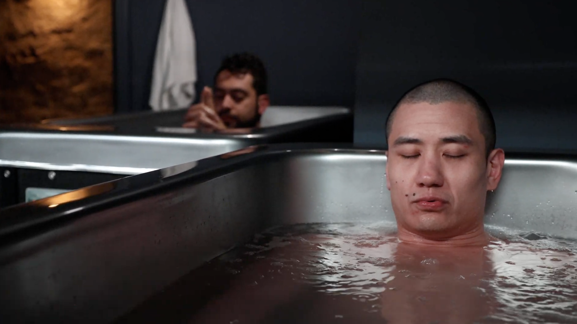 Two men practicing cold plunge therapy at MindFuel in Pittsburgh, focusing on breathwork, recovery, and mental resilience.
