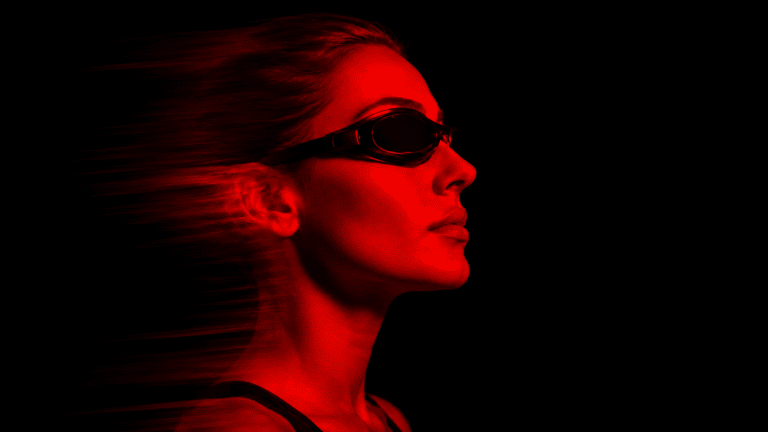 A woman sits in a red light therapy bed at MindFuel Method in the Strip District in Pittsburgh